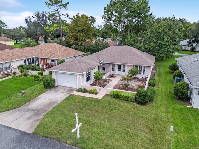 view of front facade with a front lawn and a garage