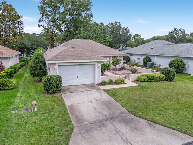 single story home featuring a front yard and a garage