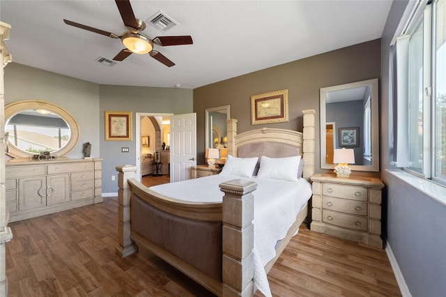 bedroom with wood-type flooring and ceiling fan