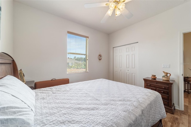 bedroom featuring ceiling fan, a closet, and hardwood / wood-style floors