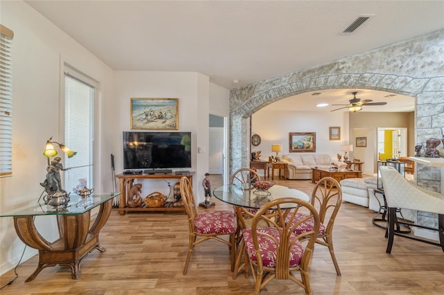 dining space featuring ceiling fan and light hardwood / wood-style floors