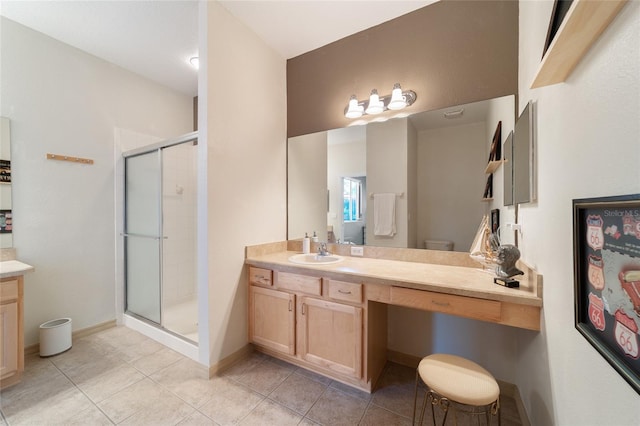 bathroom featuring tile patterned floors, a shower with shower door, vanity, and toilet