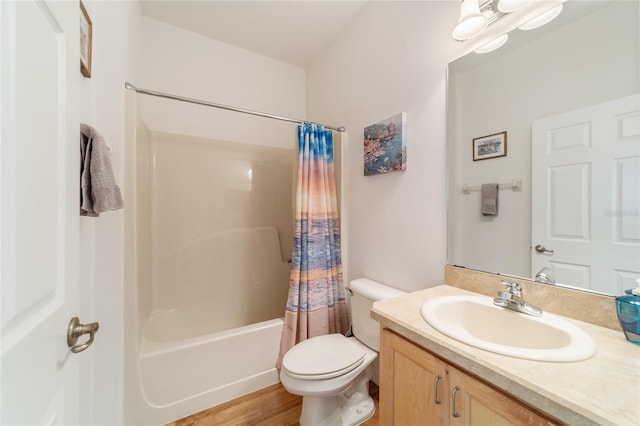 full bathroom with vanity, toilet, shower / bathtub combination with curtain, and hardwood / wood-style flooring