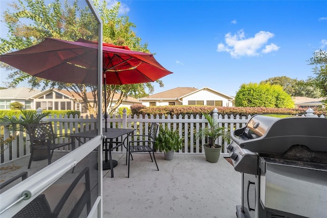 view of patio featuring a balcony