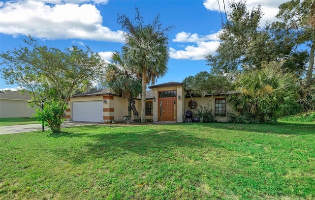 view of front of property with a garage and a front lawn