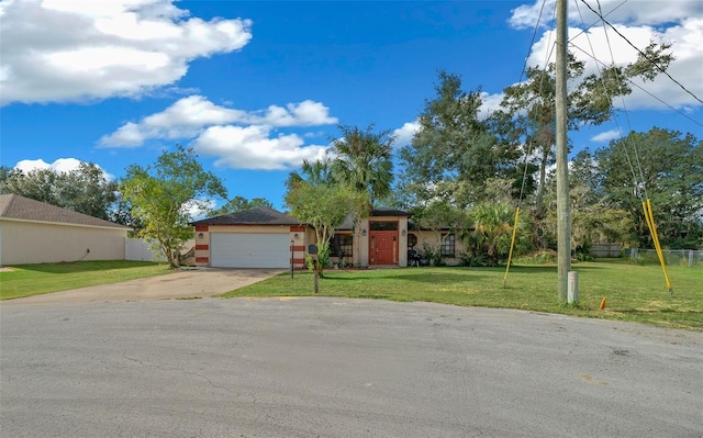 ranch-style house with a front yard and a garage