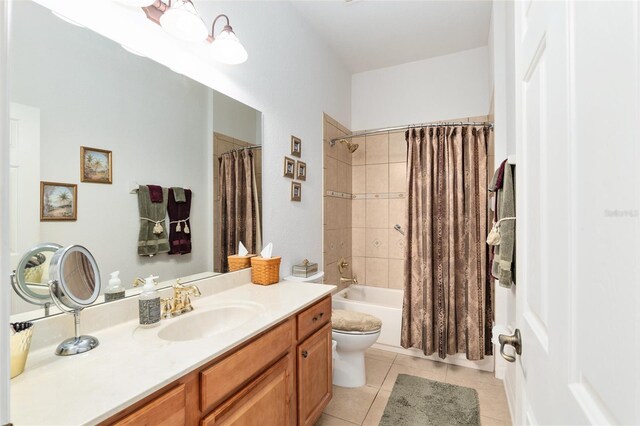 full bathroom with vanity, toilet, shower / bathtub combination with curtain, and tile patterned floors