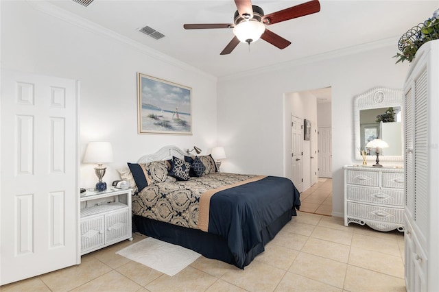 tiled bedroom with crown molding and ceiling fan