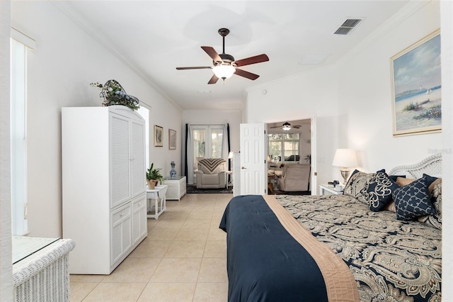 bedroom featuring ceiling fan, light tile patterned floors, and ornamental molding