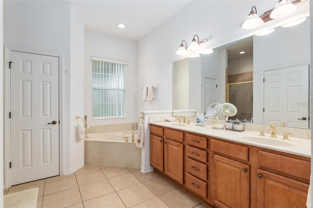 bathroom featuring vanity, separate shower and tub, and tile patterned floors