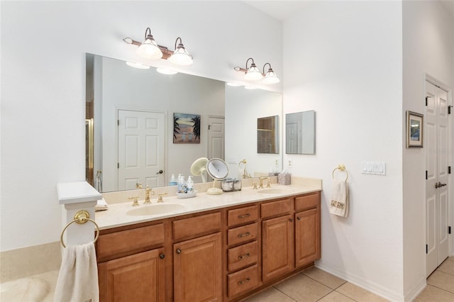 bathroom with tile patterned flooring and vanity