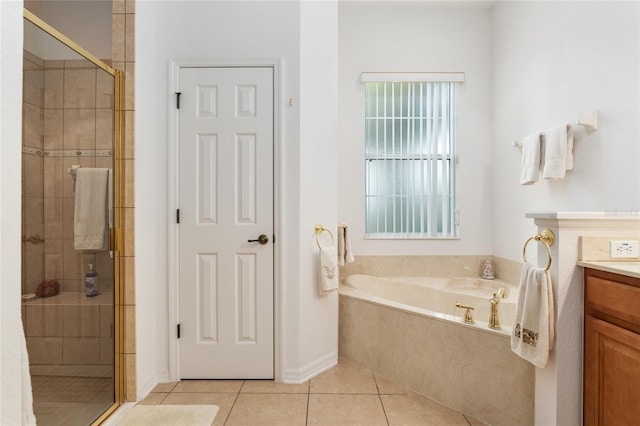 bathroom with shower with separate bathtub, tile patterned floors, and vanity