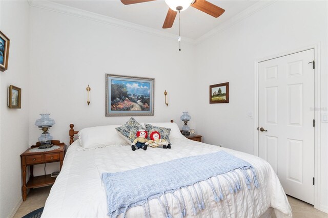 bedroom with light carpet, ceiling fan, and crown molding