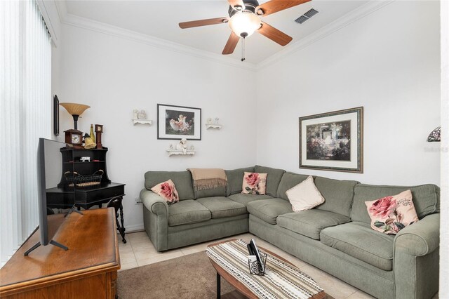 living room with crown molding, light tile patterned flooring, and ceiling fan