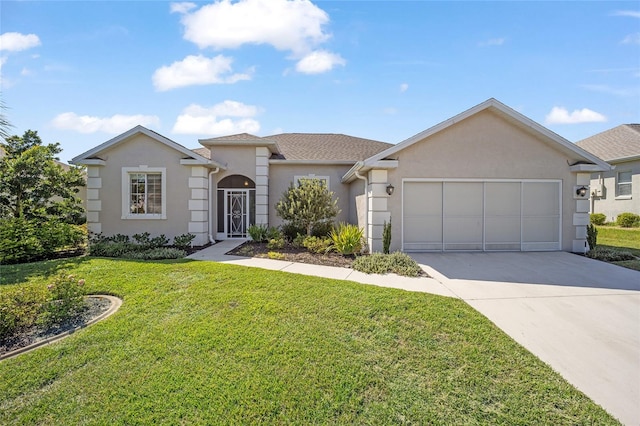 single story home featuring a garage and a front lawn