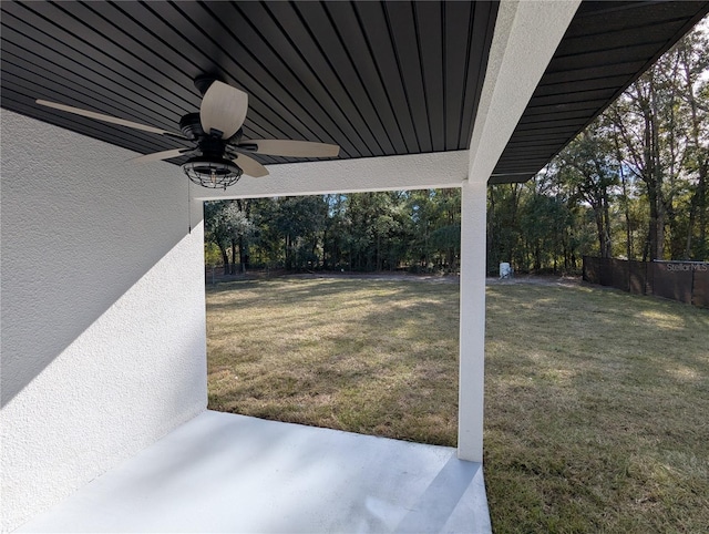 view of yard with ceiling fan