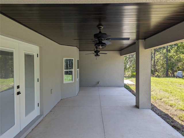 view of patio / terrace featuring ceiling fan and french doors