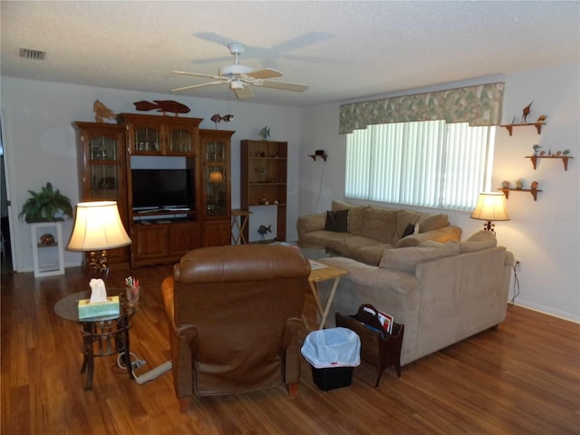 living room with ceiling fan and hardwood / wood-style floors