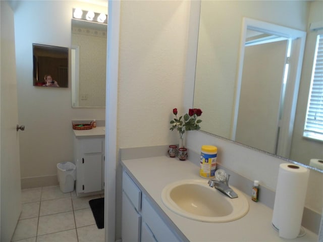 bathroom with tile patterned flooring and vanity