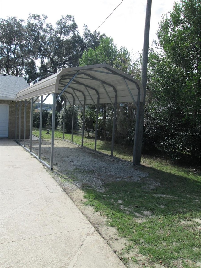 exterior space with a garage and a carport