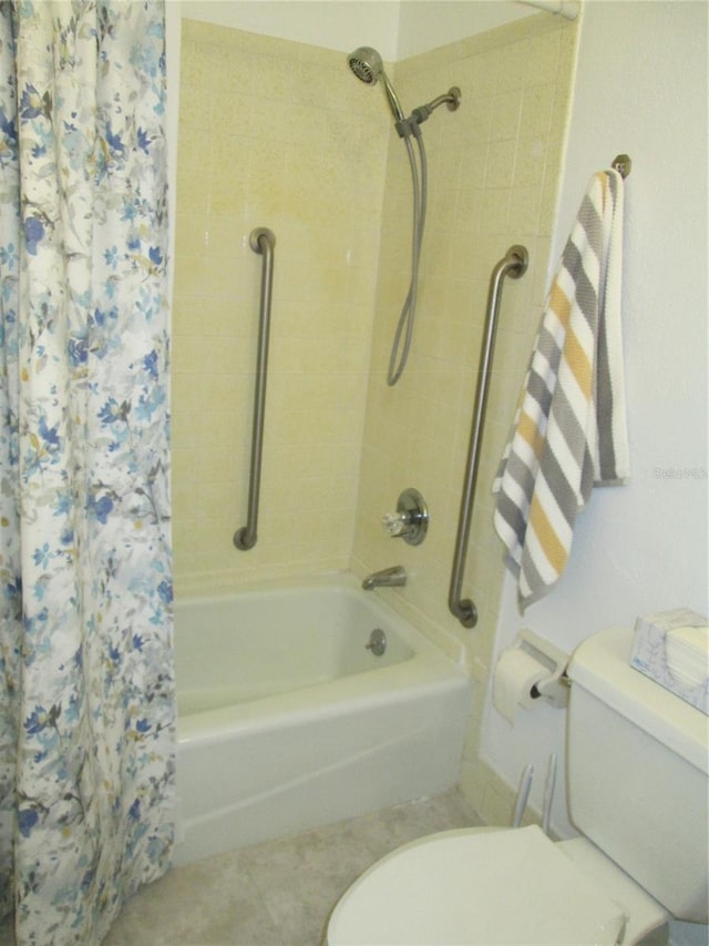 bathroom featuring toilet and shower / bath combo