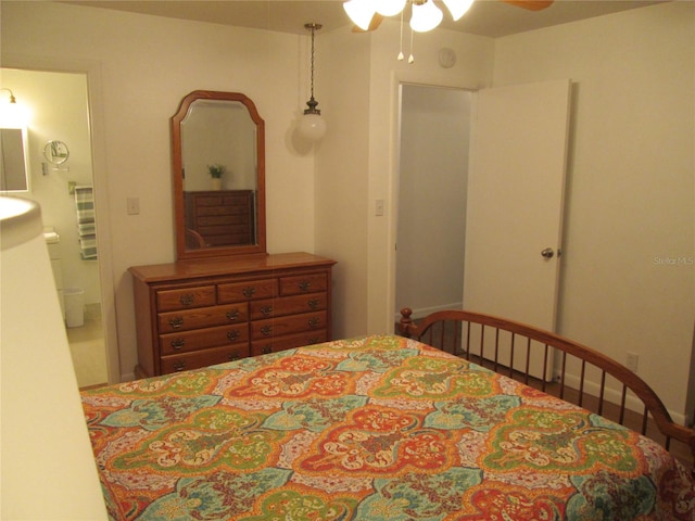 bedroom with ceiling fan and connected bathroom