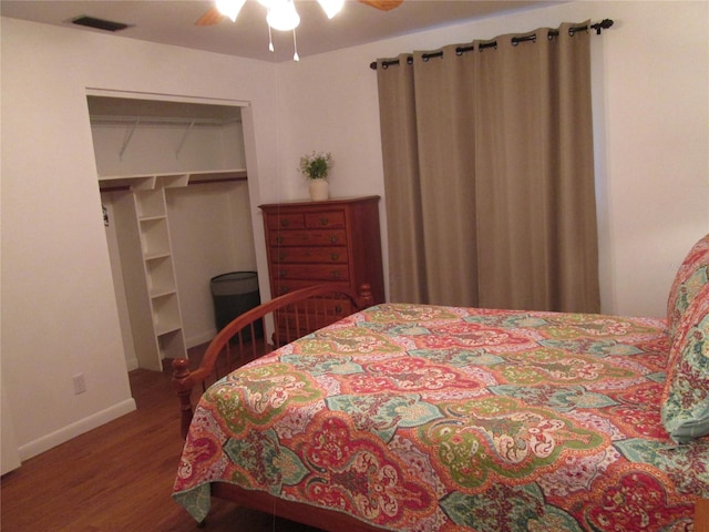 bedroom featuring ceiling fan, a closet, and hardwood / wood-style floors