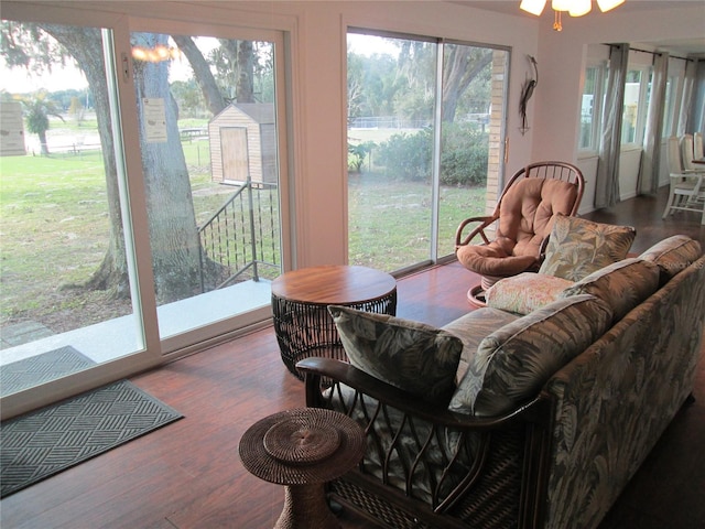 interior space with wood-type flooring and ceiling fan