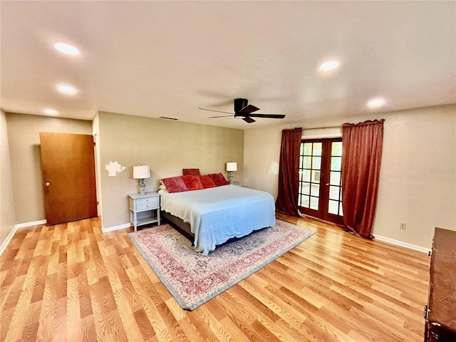 bedroom with french doors, light hardwood / wood-style flooring, and ceiling fan