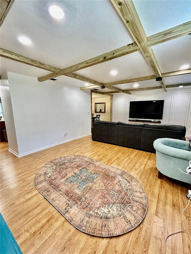 living room with beamed ceiling, wood-type flooring, and coffered ceiling