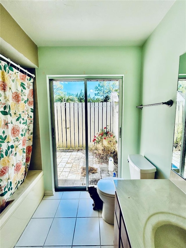 full bathroom with tile patterned floors, a wealth of natural light, vanity, and toilet