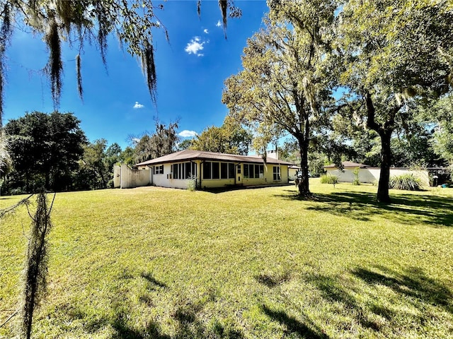 view of yard featuring a sunroom