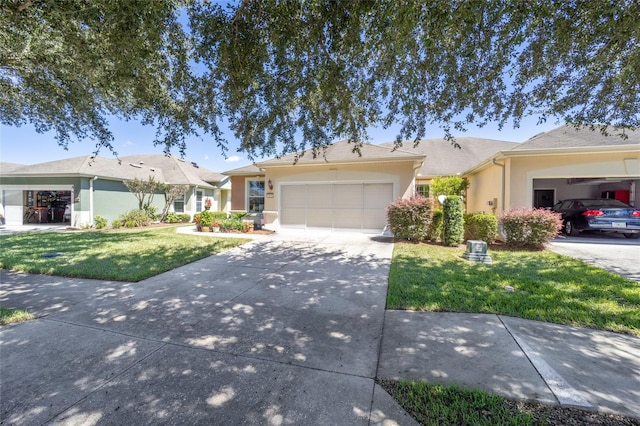 ranch-style home featuring a garage and a front lawn