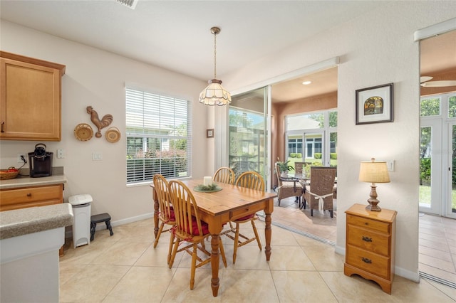 dining area featuring a wealth of natural light and light tile patterned floors