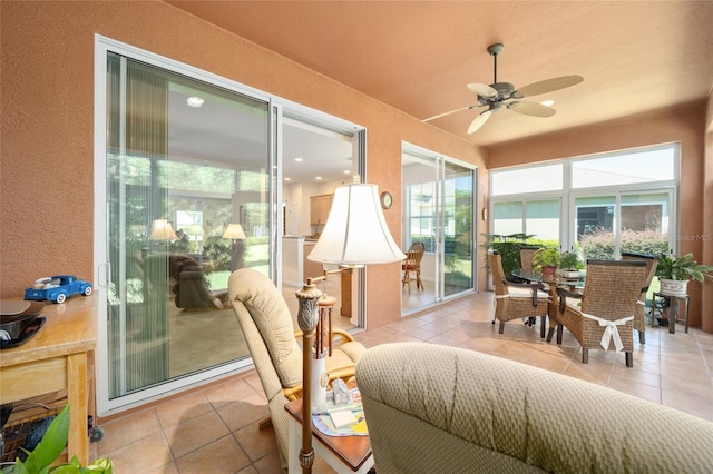 sunroom / solarium with ceiling fan and plenty of natural light