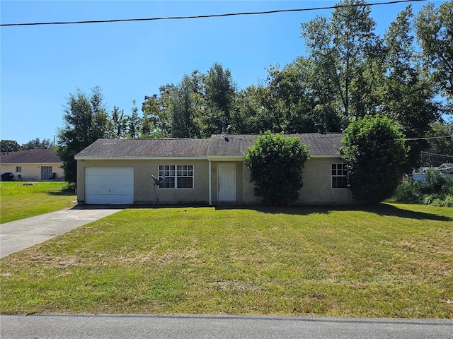 single story home featuring a front lawn and a garage