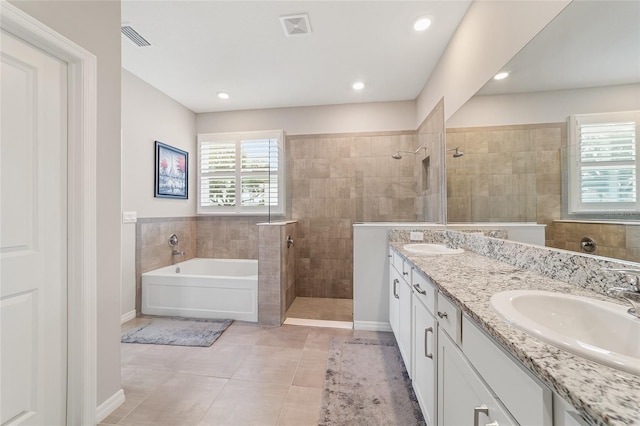 bathroom featuring vanity, separate shower and tub, and tile patterned floors