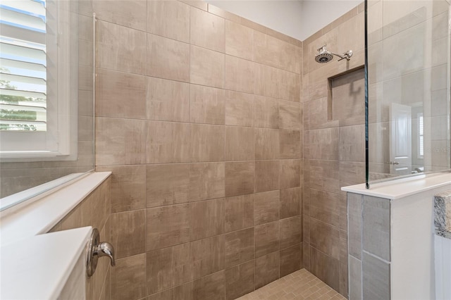 bathroom with tiled shower