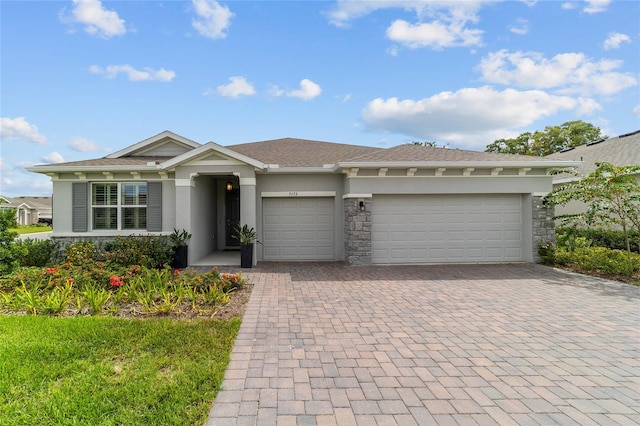 ranch-style house featuring a garage