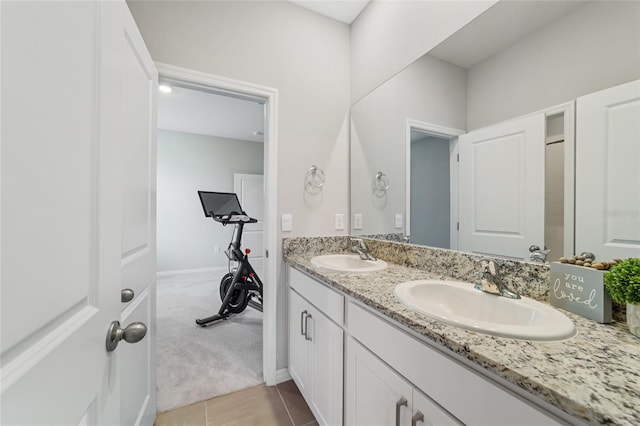 bathroom featuring tile patterned flooring and vanity