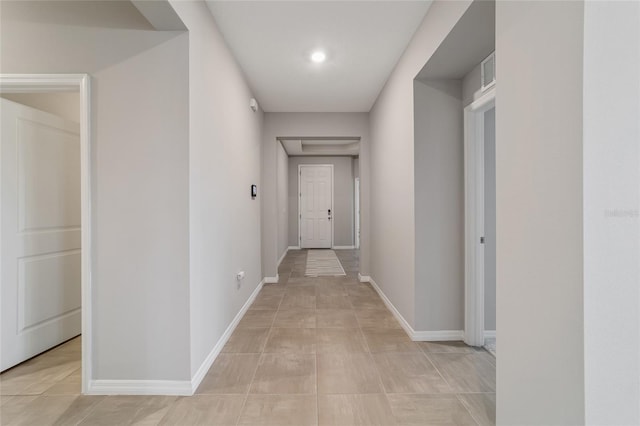 hallway featuring light tile patterned flooring