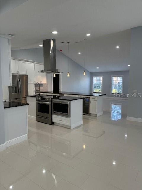 kitchen with lofted ceiling, hanging light fixtures, stainless steel appliances, range hood, and white cabinets