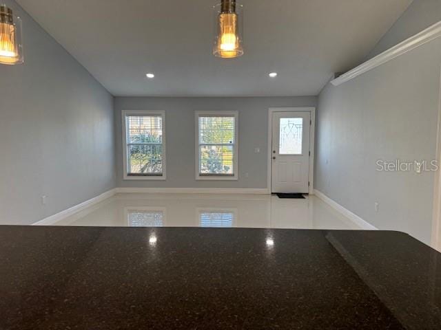 entrance foyer with lofted ceiling and a healthy amount of sunlight