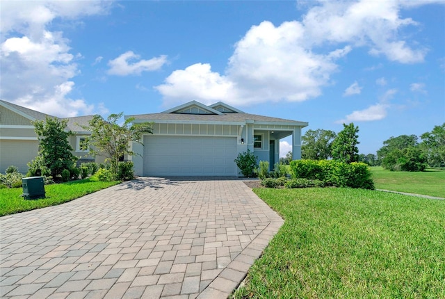 ranch-style house with a garage and a front yard