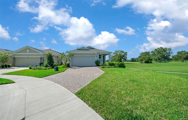 single story home featuring a front lawn and a garage