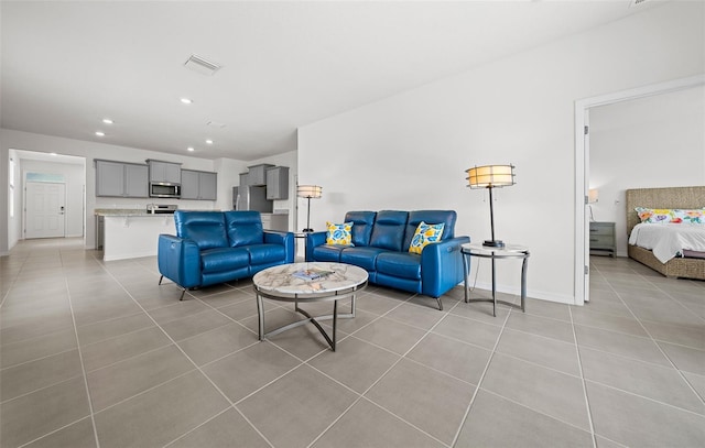 living room with light tile patterned floors