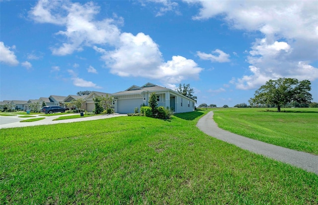 view of front facade featuring a front yard and a garage