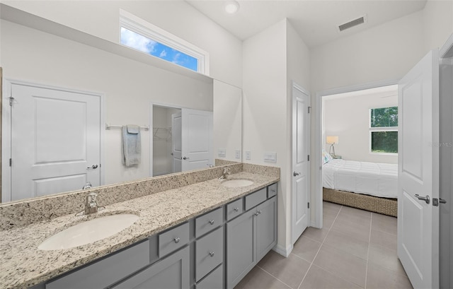 bathroom with vanity and tile patterned flooring