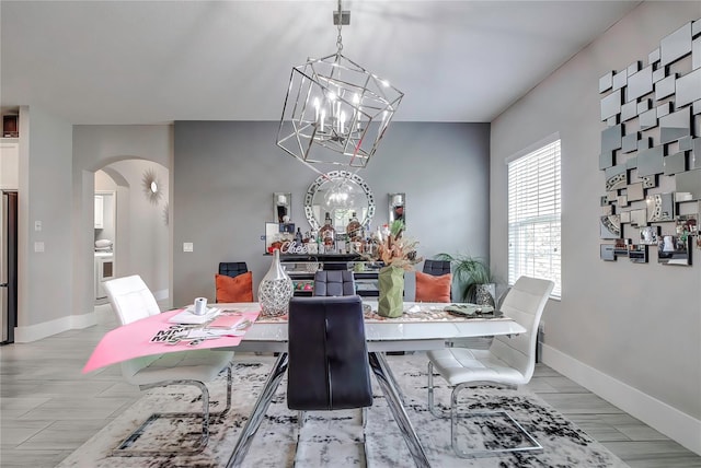 dining space featuring a chandelier