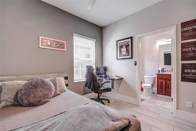 bedroom with ceiling fan and connected bathroom